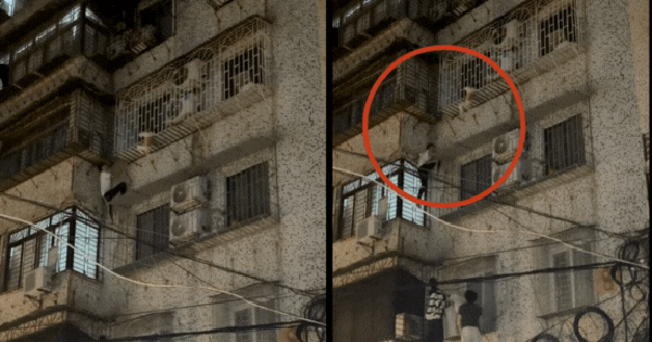 Clip nghẹt thở: Nam thanh niên leo tường chung cư, giải cứu bé trai kẹt đầu treo lơ lửng ngoài “chuồng cọp” tầng 4